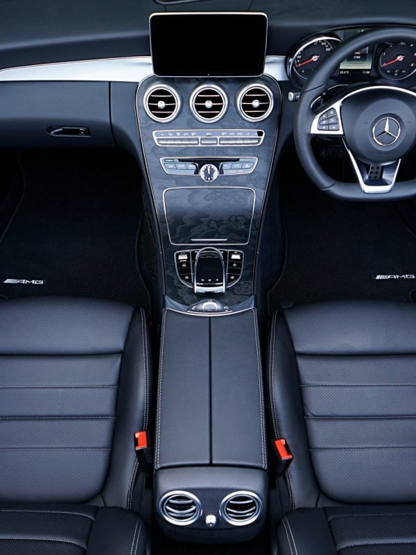 Explore a sleek and stylish Mercedes interior with premium leather seats and sophisticated dashboard.